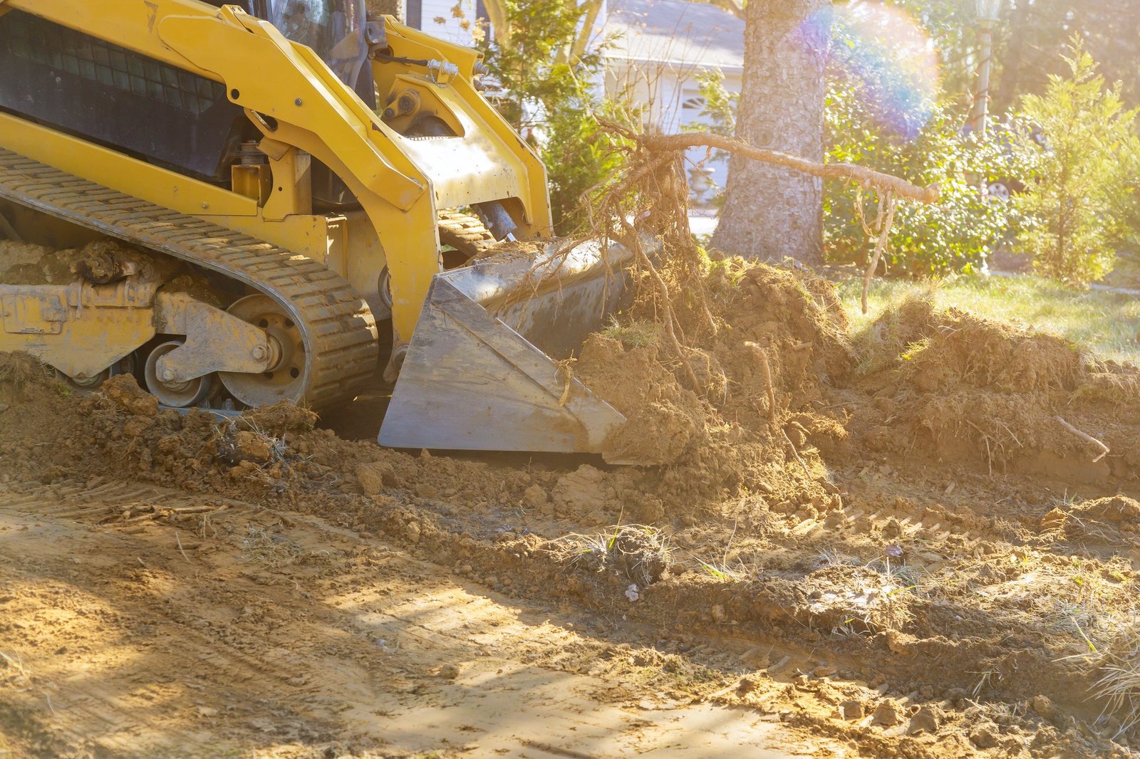 Bulldozer scoop working on the excavation works of moving earth